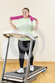 Fat Woman Running Treadmill photo