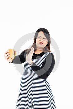 Fat woman says no eating hamburger in hand