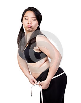 Fat Woman show overweight body tight obese by measuring tape at hip bored face weight loss concept  on white background