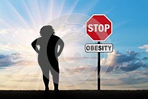 Fat woman and a sign of stop obesity