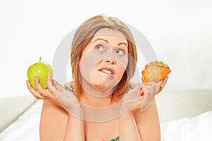 Fat woman sitting at table home