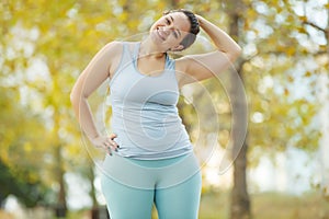 Fat woman and sports. Does exercise for weight loss in the fresh air.