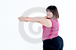 Fat woman Stretching arms to relax muscles after exercise To lose weight