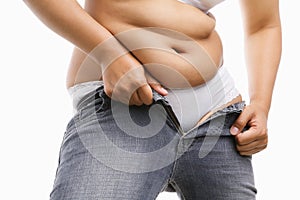 Fat woman trying to put on her tight jeans