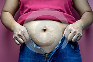 Fat woman trying to wear jeans, Overweight fat woman, Weight losing, obesity, cellulite, health care concept