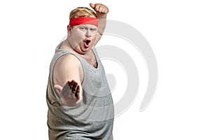 Fat young man making a gesture pointing to himself isolated on white background