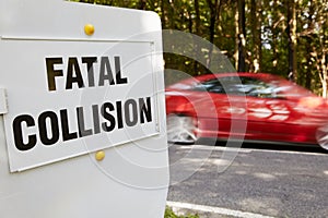 Fatal Collision Sign Next To Scene Of Accident On Busy Road