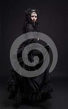 Fatal woman in vintage black dress
