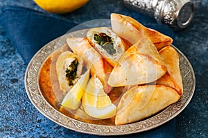 Fatayer sabanekh - traditional arabic spinach triangle hand pies photo