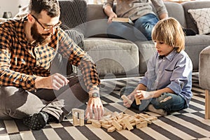 Father arranging bricks with son