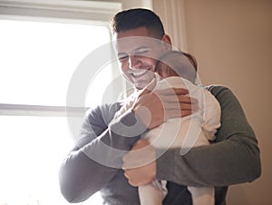 Father, baby and bonding with happiness and hug, growth and child development with love at family home. Man, infant or