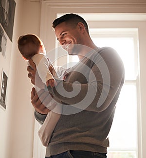 Father, baby and bonding with happiness and love, growth and child development with joy at family home. Man, infant or