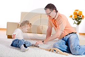 Father and baby boy playing