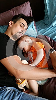 Father And Baby Boy Sleeping