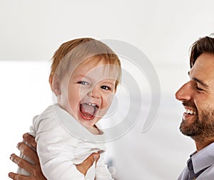 Father, baby and excited portrait with play in home for healthy development, parenting and bonding on weekend. Family