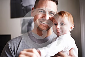 Father, baby and fun portrait in a new home with smile and relax of a newborn with dad together. Love, support and care