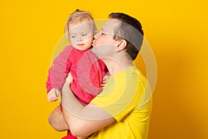 Father with baby girl smiling and hugging. Family concept. Happy father`s day