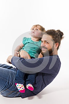 Father with baby in her arms