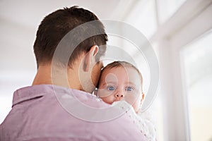 Father, baby and home with portrait, support and bonding together with newborn and love. Happy, family and dad with