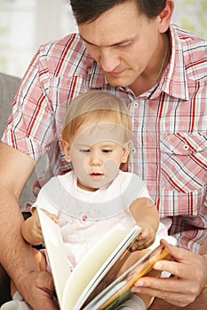 Father and baby reading book