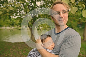 Father and baby son bonding together at the park