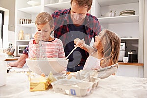 Father baking with children