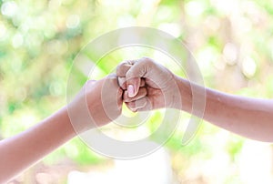 Father and boy hands - Fist bump