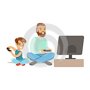 Father And Boy Sitting On The Floor With Joysticks,Part Of Happy Gamers Enjoying Playing Video Game, People Indoors