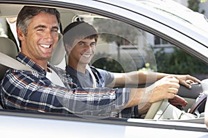 Father On Car Journey With Teenage Son