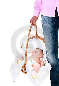 Father carrying baby in basket