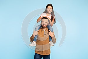 Father Carrying Daughter While She Sits On His Shoulders, Studio