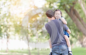 Father carrying and encourage his daughter