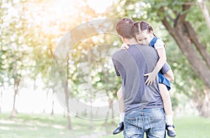 Father carrying and encourage his daughter