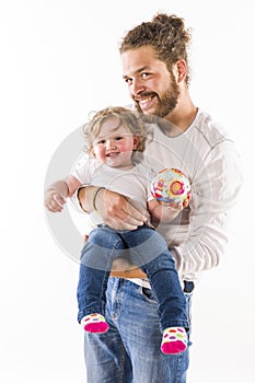 Father carrying his proud child in her arms