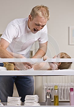 Father Changing Diapers