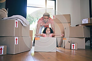 Father, child and box in new home for games, fun and freedom for bonding in real estate property. Happy dad, excited kid