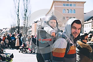 Father with child celebrate carnival at old center of Ljubljana, Slovenia.