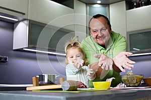 Father and child cooking.