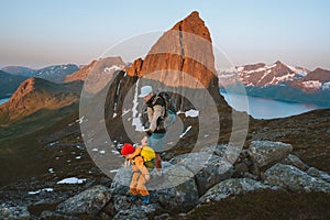 Father and child hiking in mountains of Norway family travel adventure healthy lifestyle outdoor active vacations together