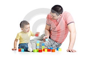 Father and child playing construction game together