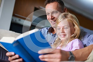 Father, child and reading a book for education at home, story and fantasy fiction for homeschooling. Daddy, daughter and