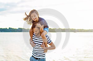 Father with a child spending the day at the beach