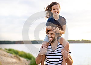 Father with a child spending the day at the beach