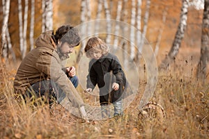 Father and child in the wild forest.