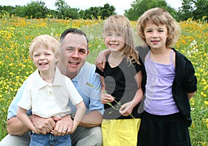 Father and Children in Flower Field