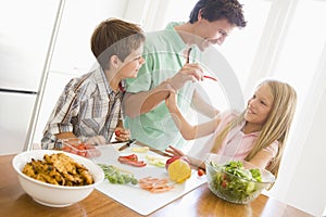 Father And Children Prepare A meal