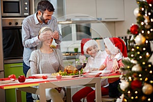 Father and children surprises mother with Christmas dinner