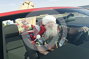 Father Christmas In Convertible With Surfboard