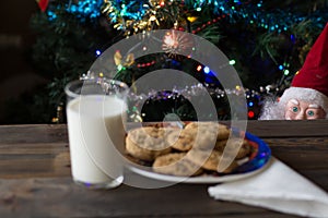 Father Christmas toy, cookies and glass of milk