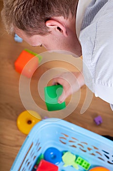 Father cleaning after child